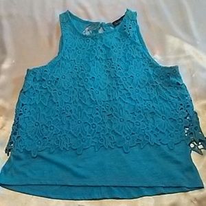 Sleeveless top with lace like crochet overlay
